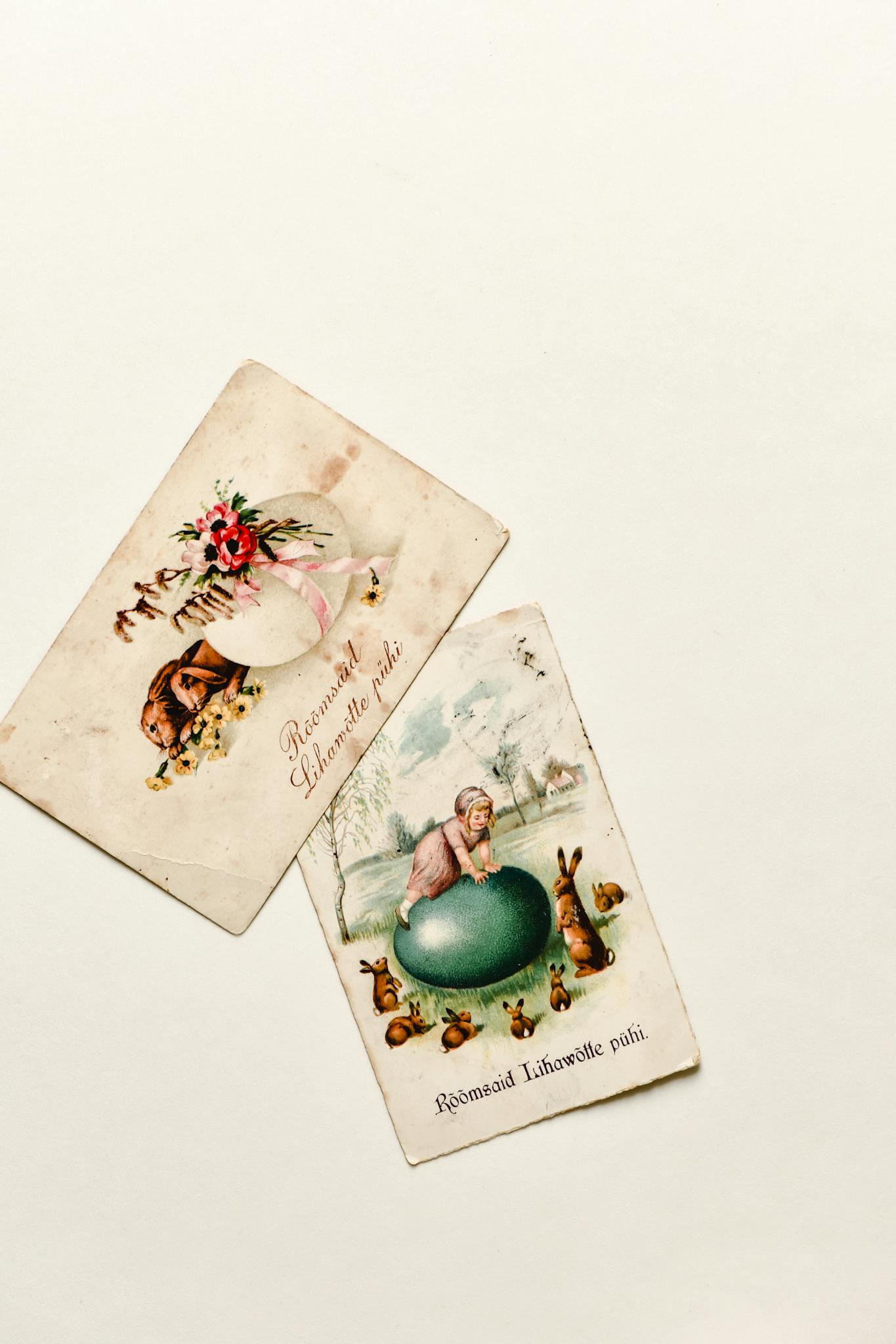 Two vintage Easter cards featuring floral and bunny illustrations on a neutral background.